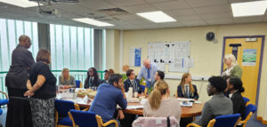 School Council members meet with School governors in what looks like a meeting room